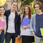 positive-teenagers-posing-together-university